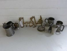 Mixed Lot: Various pewter tankards, a knights head table lighter, an Arabic welcome sign etc