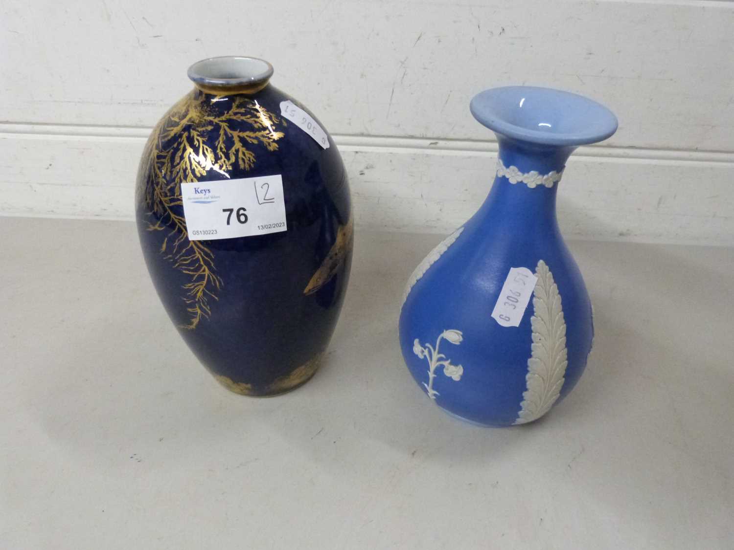 George Jones crescent ware vase decorated with fish together with a further Jasper style vase