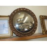 Circular convex wall mirror in gilt finish frame