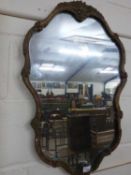 20th Century continental wall mirror in foliate moulded frame