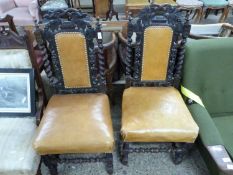 Pair of Victorian Gothic oak dining chairs with leather upholstered seat and backs