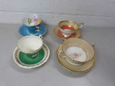 Group of three Aynsley cups and saucers together with a Royal Doulton cup and saucer