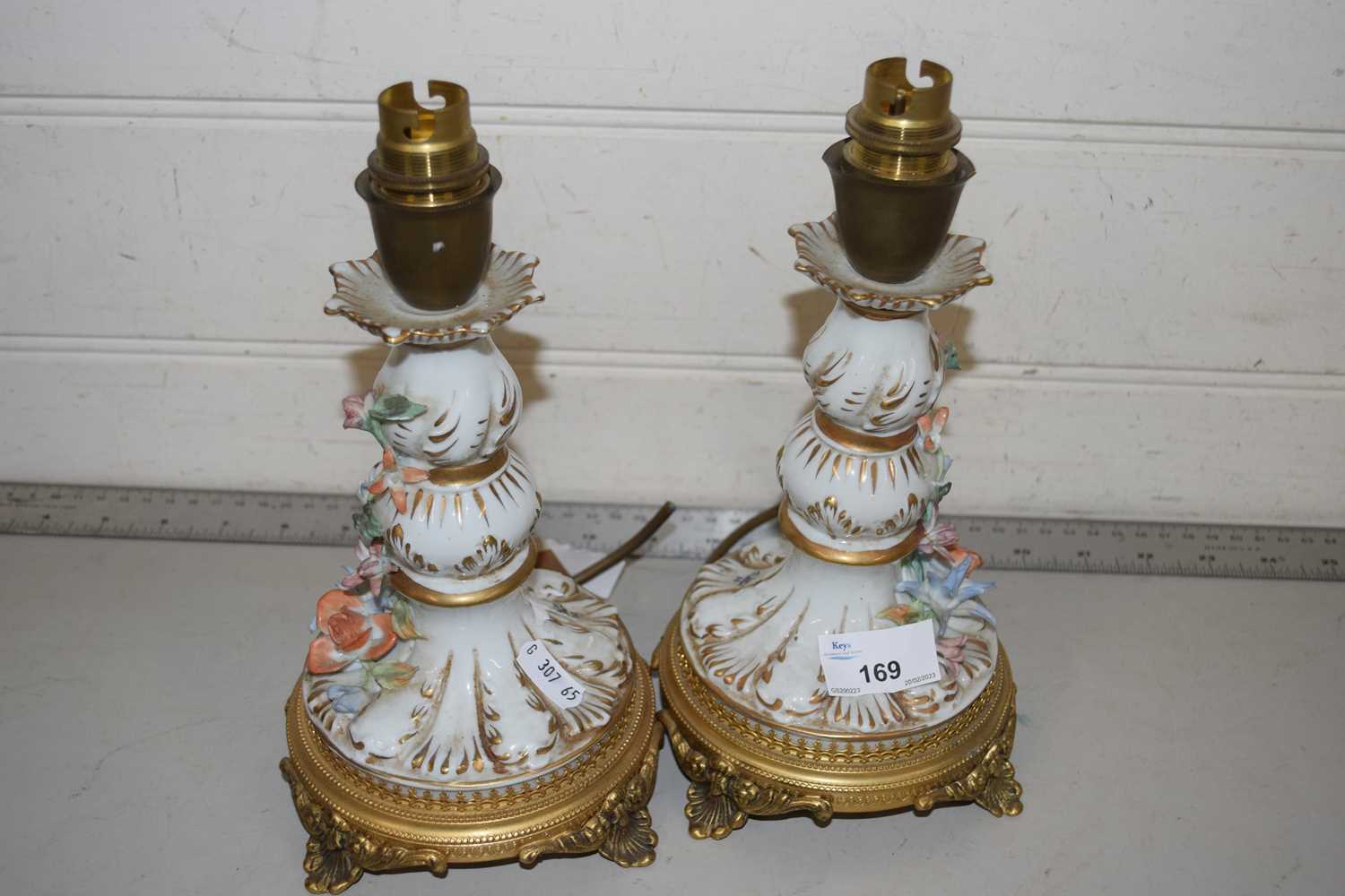 A pair of porcelain and metal mounted table lamp bases