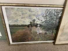 Contemporary print after Monet of a lady, gentleman and child strolling in a meadow, glazed with