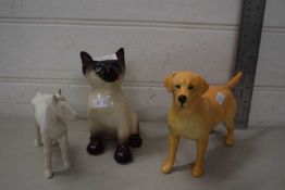 A Beswick model labrador together with a Winstanley Pottery cat and a further model horse (3)
