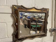 Rectangular bevelled wall mirror set in a rope finish gilt frame