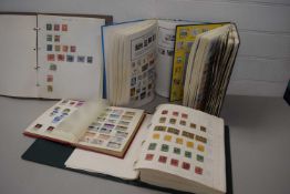 A collection of various stamp albums and contents