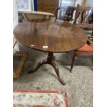 Georgian mahogany supper table with circular single plank top over a turned column and tripod