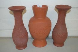 Three modern Oriental terracotta vases decorated with dragons