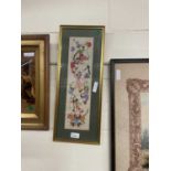 Cross stitch scene of clowns, glazed in gilt frame