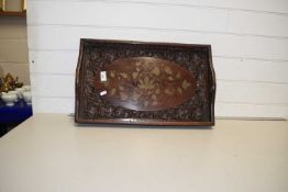 An Indian hardwood brass inlaid and carved serving tray