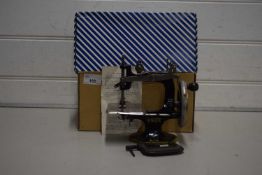 Boxed miniature Singer sewing machine