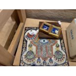 An Egyptian hand painted tile and three small pictures