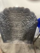Decorated cast iron fire back