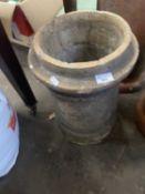 Squat pale terracotta cylindrical chimney pot