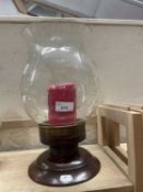 A storm lantern with wooden turned base and engraved decoration to glass lantern