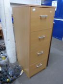 Light wood finish four drawer filing cabinet