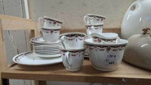 A quantity of pink and green floral decorated tea wares