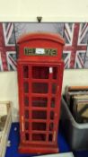 Small cabinet formed as a red telephone box