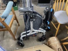Folding wheeled walker