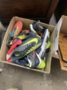 Box of trainers and football boots