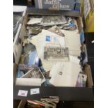 A large box of assorted postcards