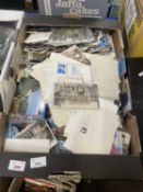 A large box of assorted postcards