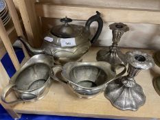 A silver plated tea set and a pair of candlesticks