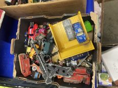 A box of various assorted toy vehicles, cap gun etc