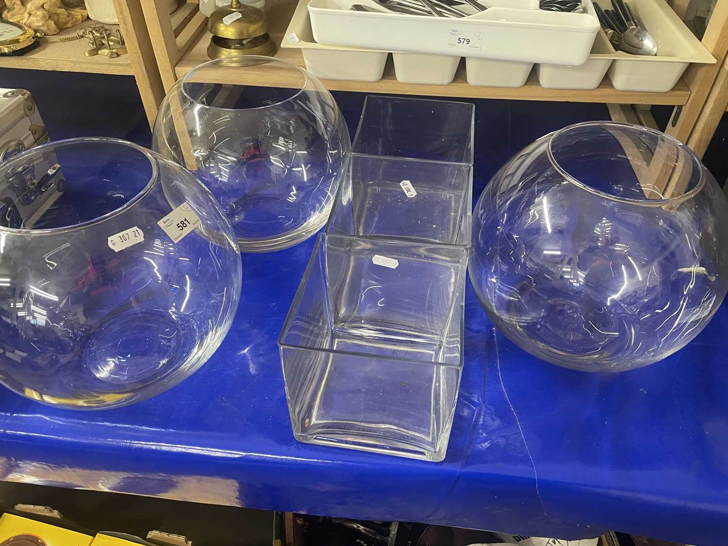 Three square clear glass vases plus three circular clear glass vases (6)