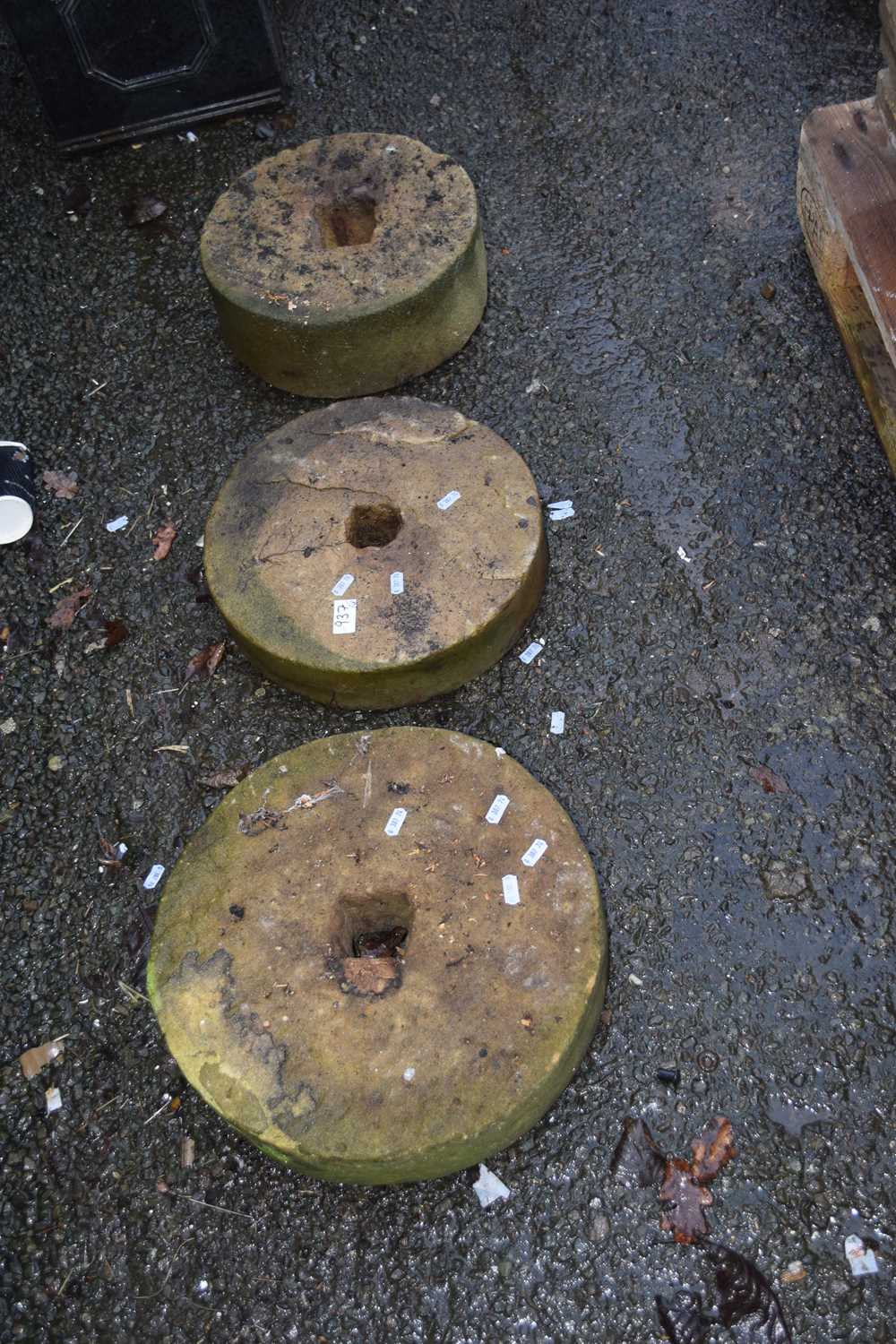 Three various vintage grind stones