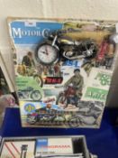 Wall mounted motorcycle shaped clock on a montage backing