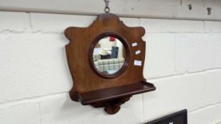 Small circular combination wall mirror and mahogany shelf