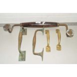 Mixed lot comprising two pairs of brass door handles together with a further large wood mounted door