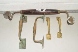 Mixed lot comprising two pairs of brass door handles together with a further large wood mounted door
