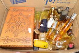 Box containing a collection of various bottles of perfume