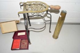 Brass and iron fireside trivet, a vintage shell case and a boxed Bezique card game (3)