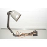 A vintage wall mounted industrial light fitting