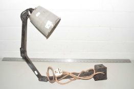 A vintage wall mounted industrial light fitting