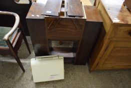 A vintage oak sewing table together with a Frister & Rossmann cub sewing machine