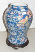 Large modern Chinese floral decorated vase with wooden stand