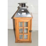 Wooden framed and metal mounted lantern
