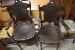 A pair of bent wood and pressed ply armchairs, the seats and back decorated with classical scenes,