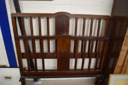 An Edwardian mahogany and iron bed frame