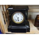 A Victorian black slate and marble mounted mantel clock