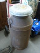 A cast iron milk urn approx 74cm high