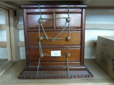 A small 20th Century apprentice style four drawer chest