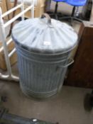 An aluminium dustbin and lid