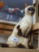 A Beswick matt finish model of a Siamese cat together with a further Just Cats & Co model (2)