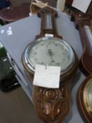A reproduction mahogany barometer with chrome face